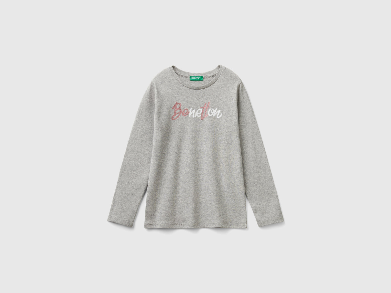 T-shirt manica lunga con stampa glitter da bambina grigio chiaro | Benetton Outlet