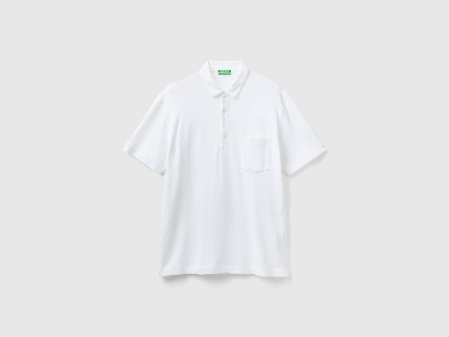 Polo con taschino relaxed fit da uomo bianco panna | Benetton Outlet