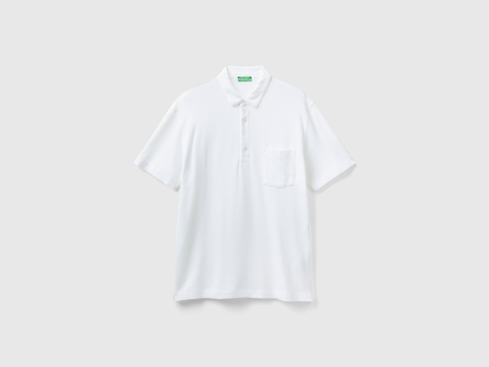 Polo con taschino relaxed fit da uomo bianco panna | Benetton Outlet