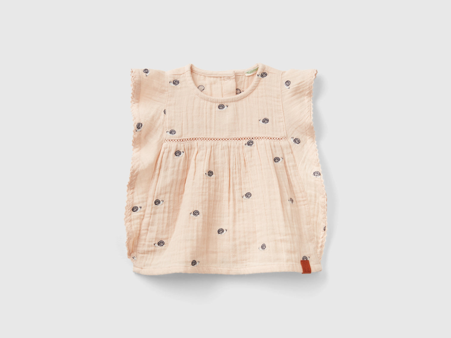 Blusa con volant e ricami da neonato pesca | Benetton Outlet