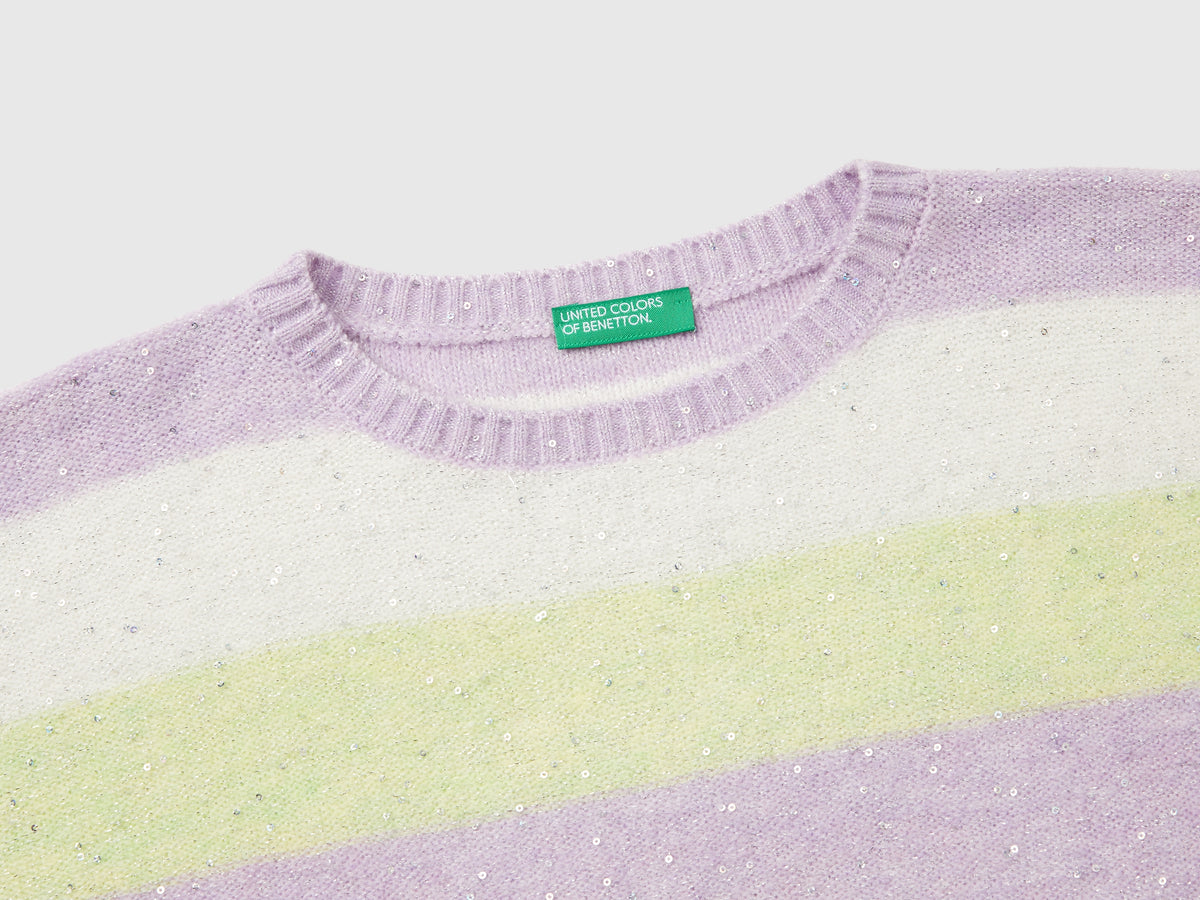 Sweater with recycled fabric and sequins