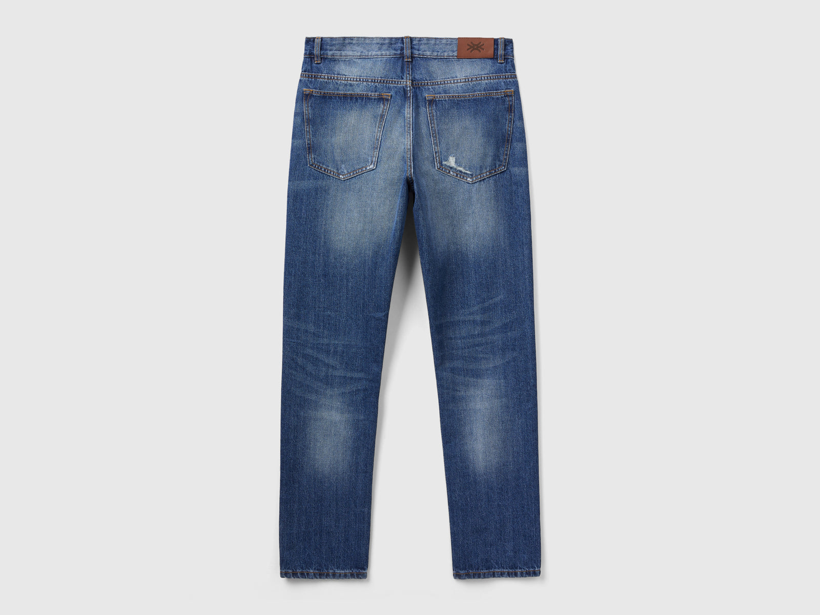 Jeans straight con rotture da uomo azzurro 2 | Benetton Outlet
