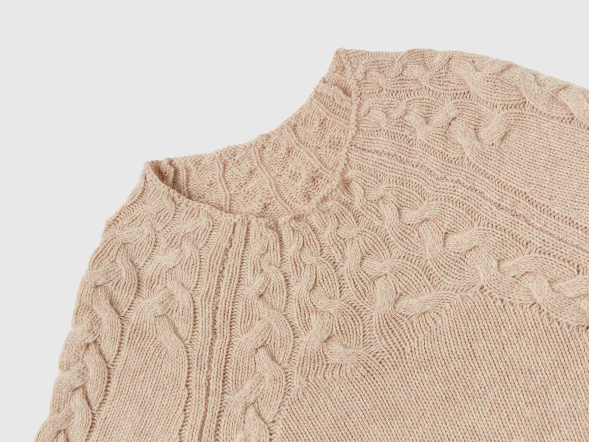 Maglione con trecce