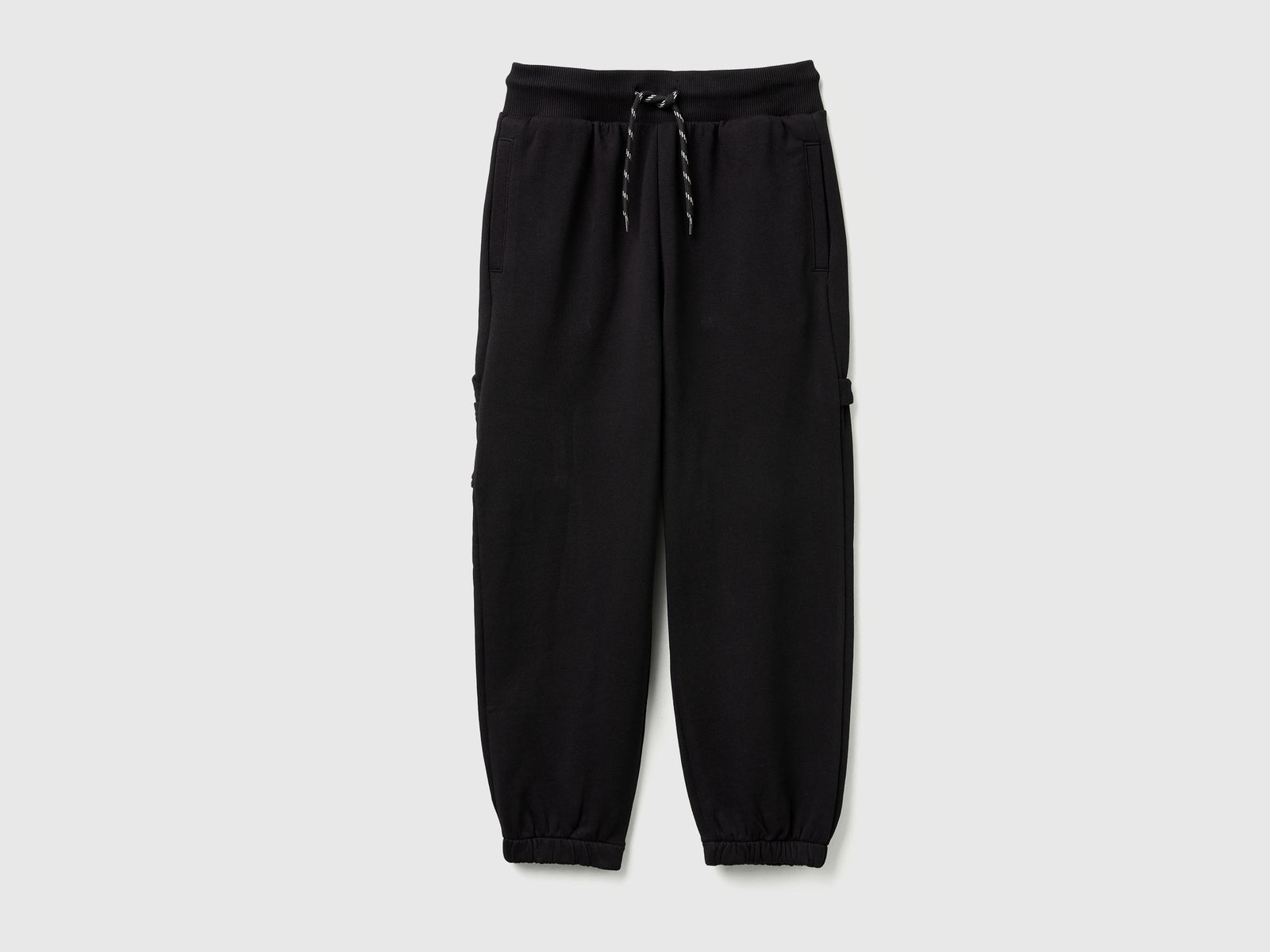 Joggers ampi con tasche da bambino nero | Benetton Outlet