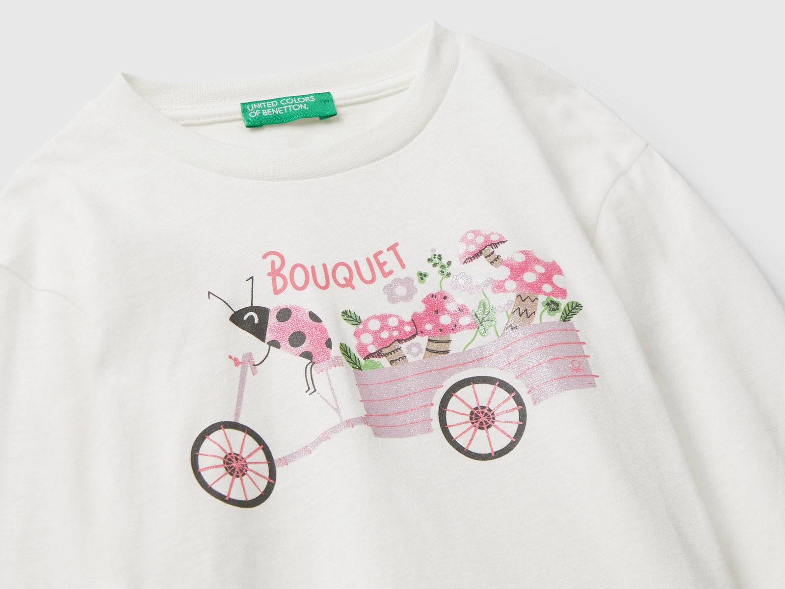 Maglietta in cotone con stampa glitter da bimba bianco panna 3 | Benetton Outlet