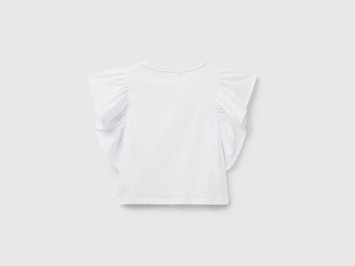 T-shirt smanicata in puro cotone con ampi volant applicati sul giromanica