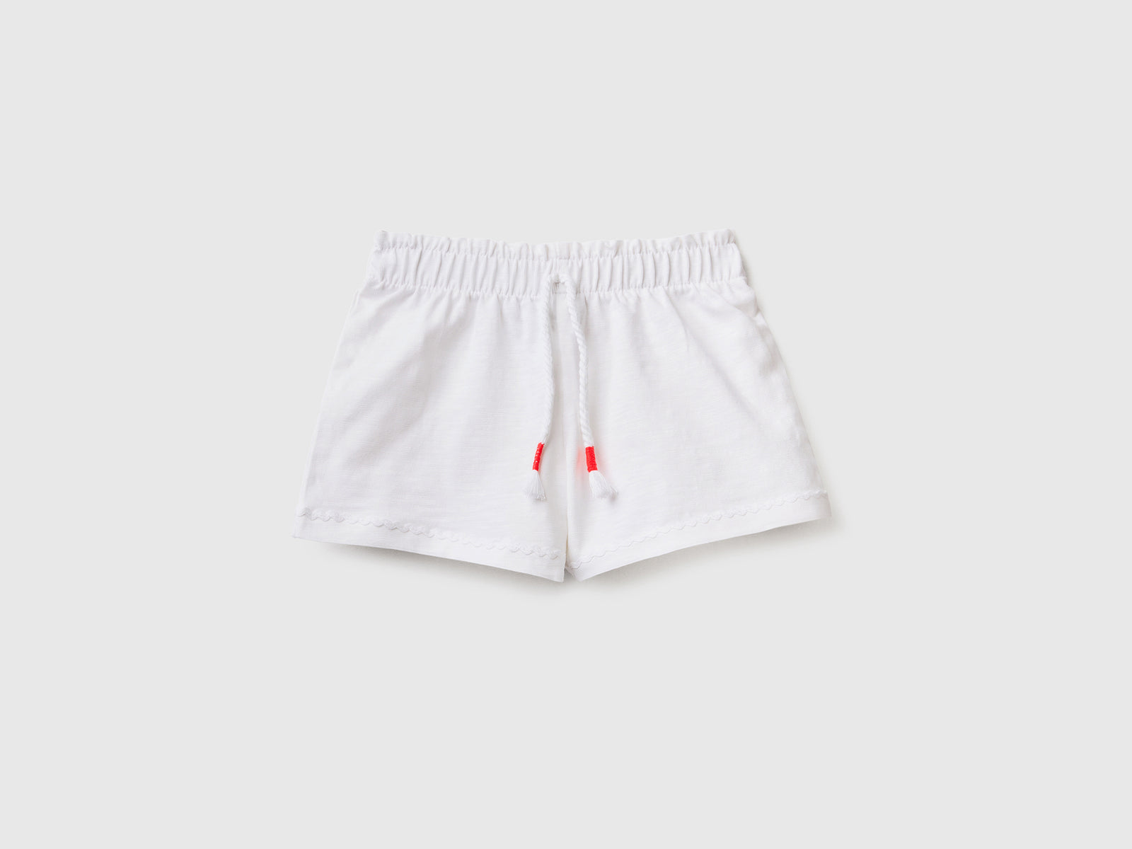 Pantaloni corti leggeri in cotone elasticizzato da neonato bianco | Benetton Outlet