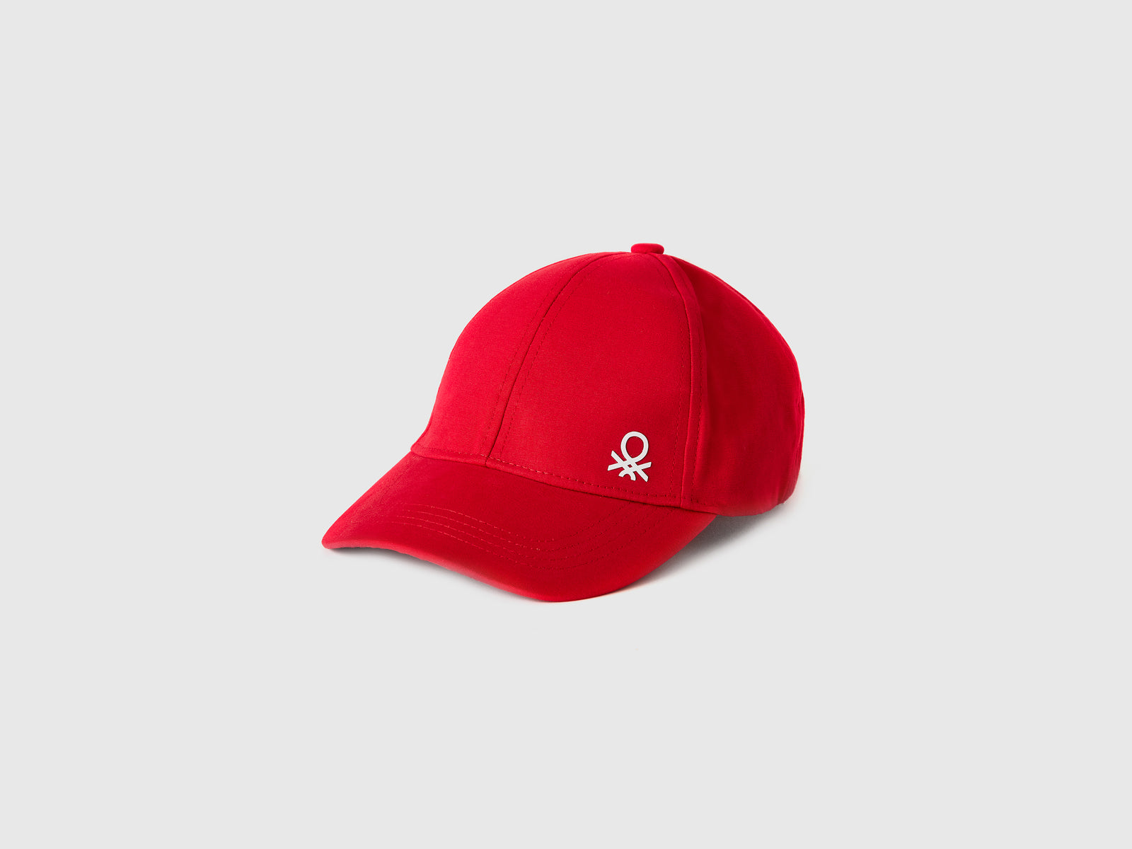 Cappellino con visiera da bimbo rosso | Benetton Outlet