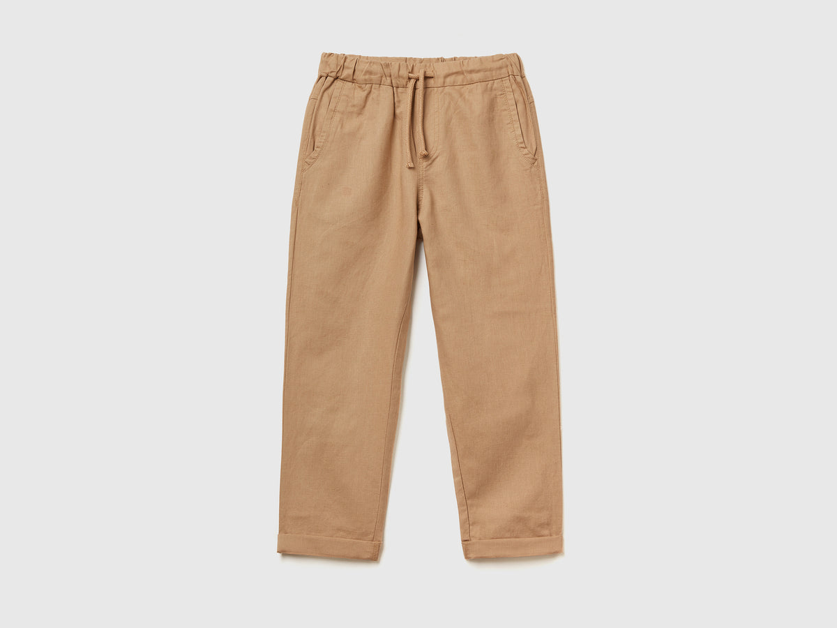 Pantaloni lunghi slim fit in lino misto cotone da bambino cammello | Benetton Outlet