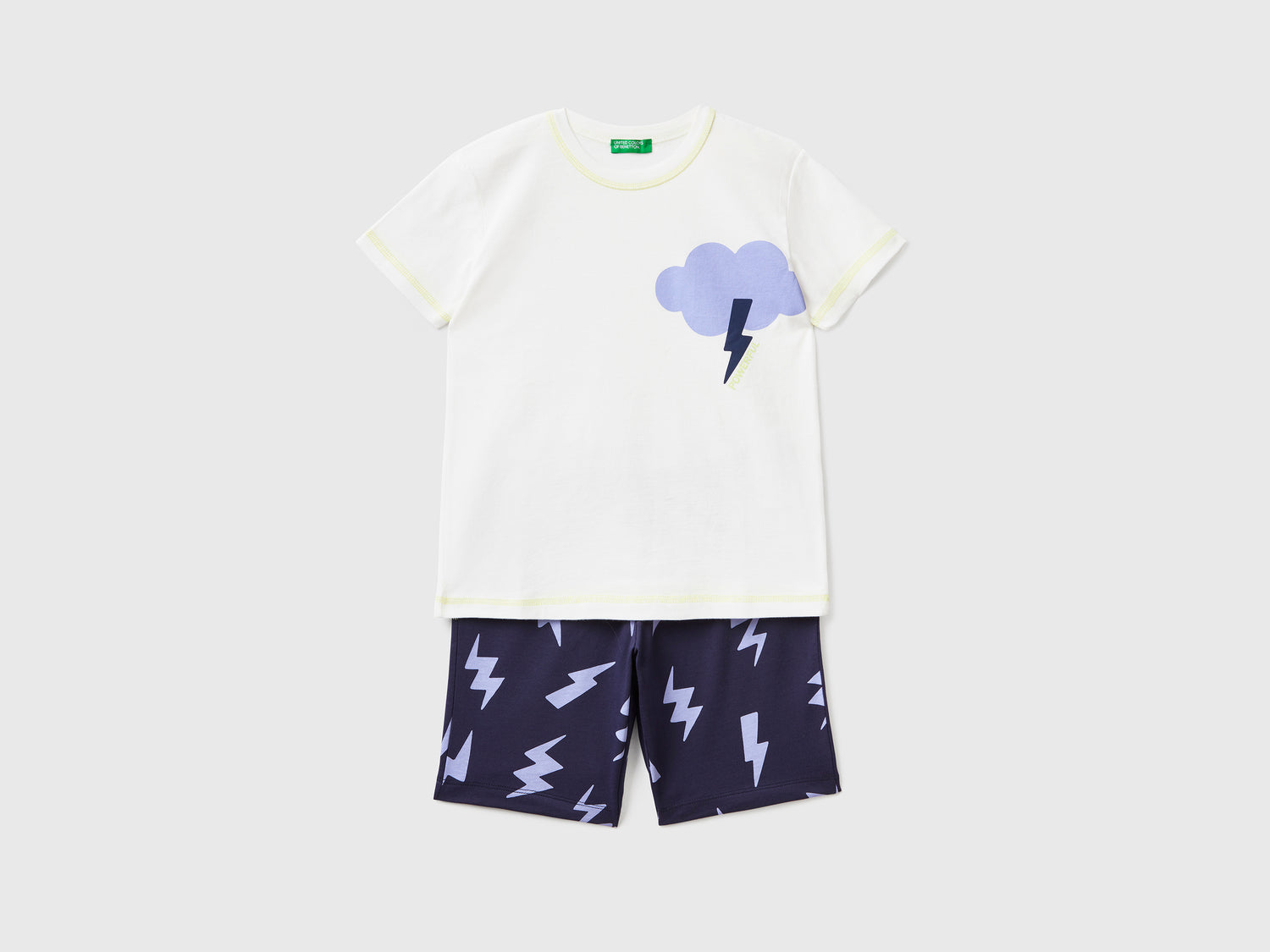 Pigiama corto in puro cotone leggero arricchito da dettagli luminescenti da bambino bianco panna | Benetton Outlet