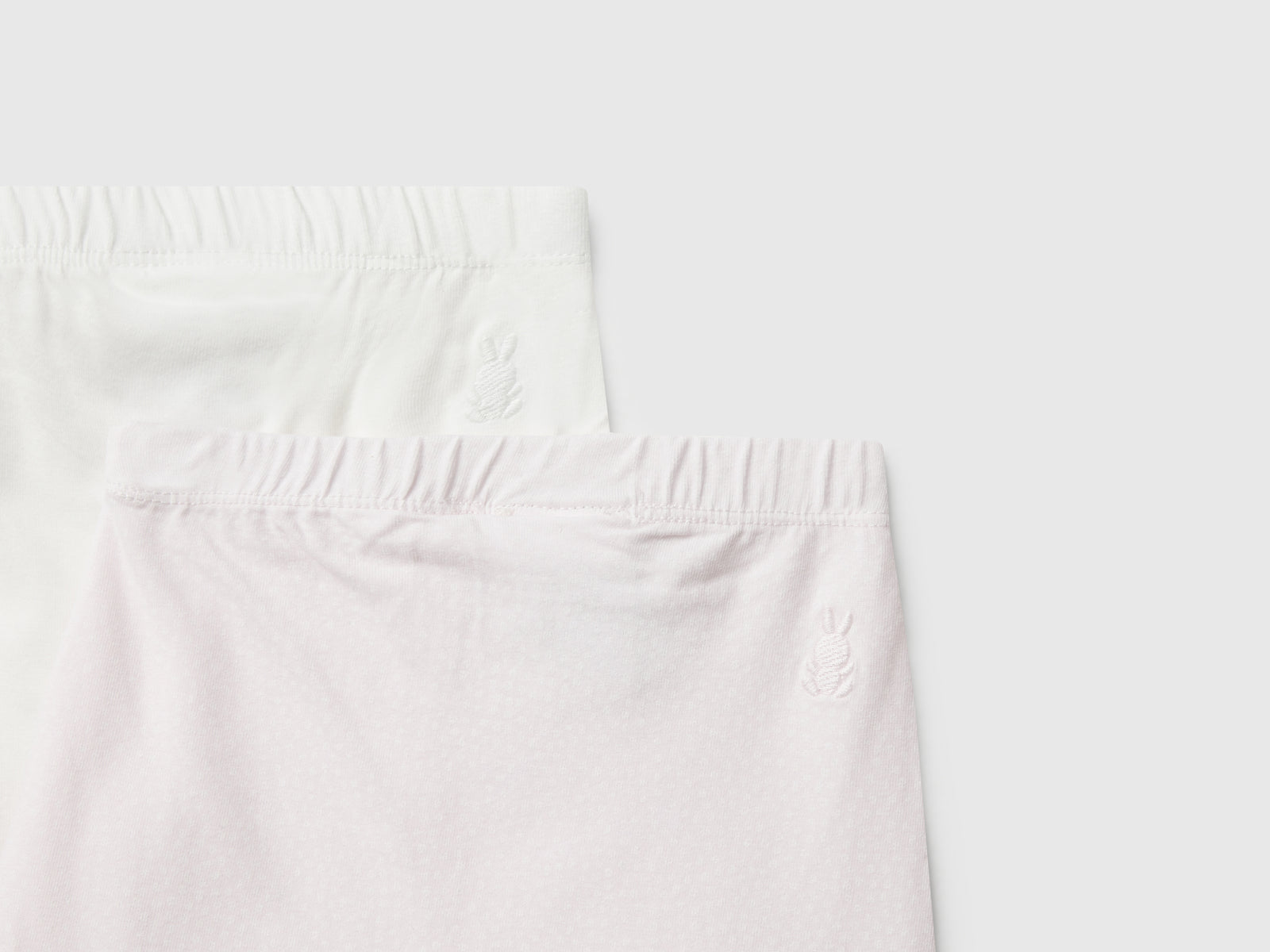 Due pantaloni in cotone da neonato rosa pastello 3 | Benetton Outlet