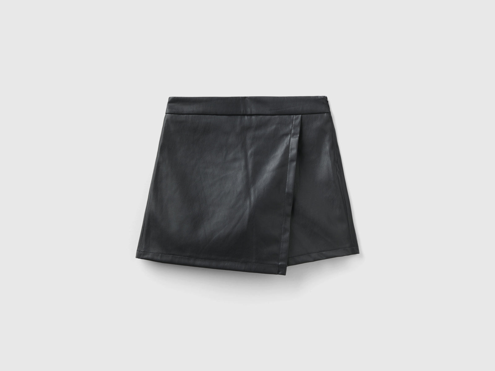 Pantaloni in tessuto spalmato da bambina nero | Benetton Outlet