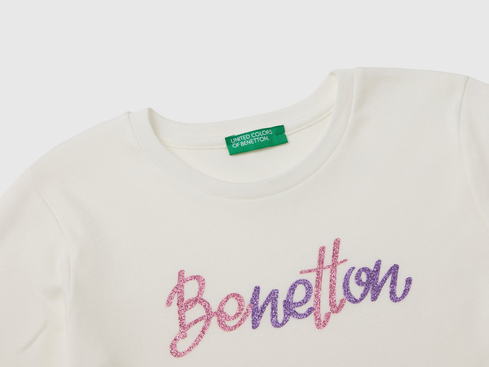 T-shirt manica lunga con stampa glitter da bambina bianco panna 3 | Benetton Outlet