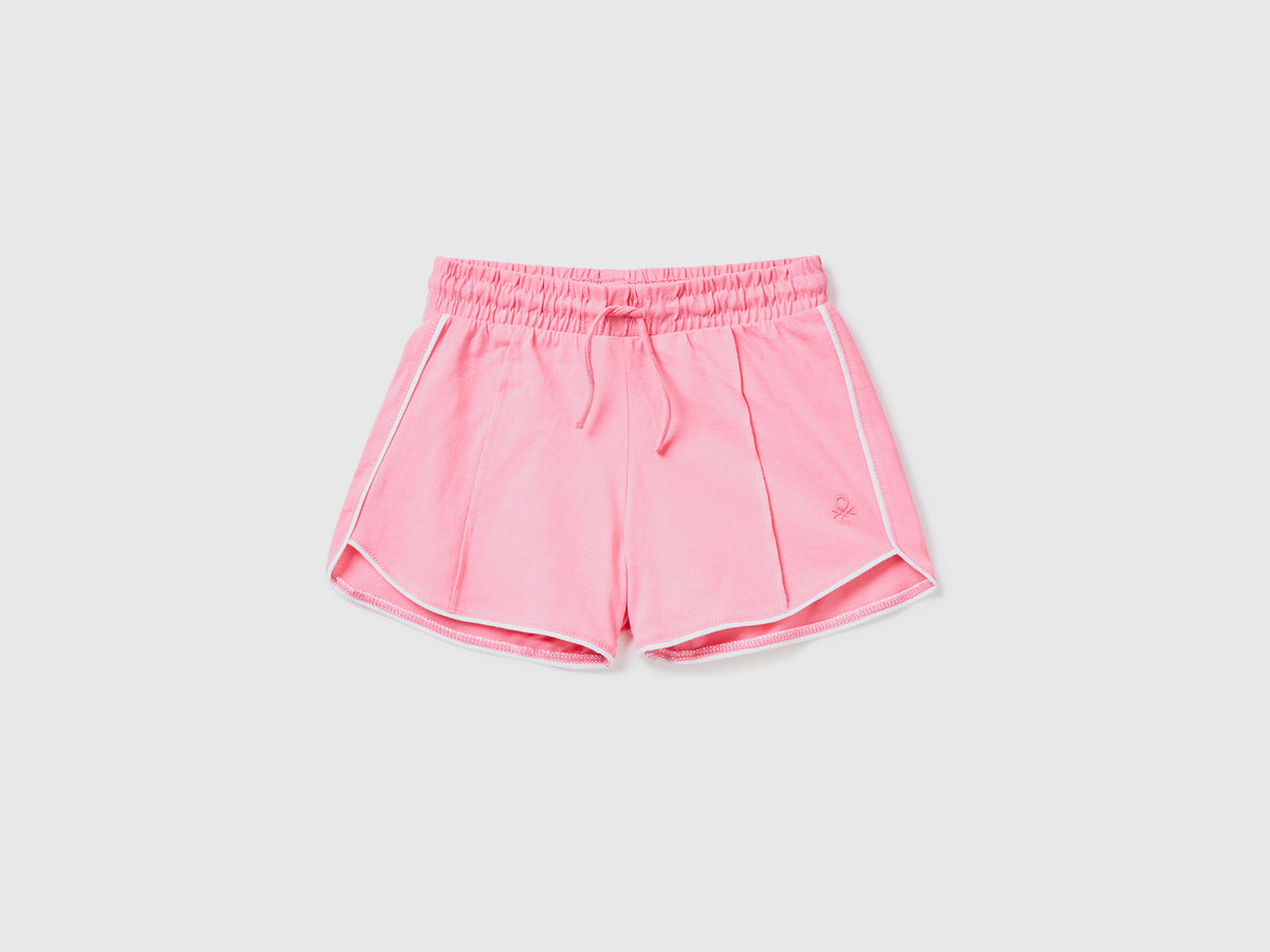 Pantaloni corti in puro cotone con piping a costrasto da bambina rosa | Benetton Outlet