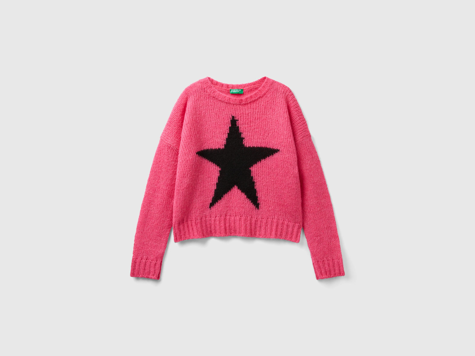Maglione con intarsio stella da bambina fucsia | Benetton Outlet