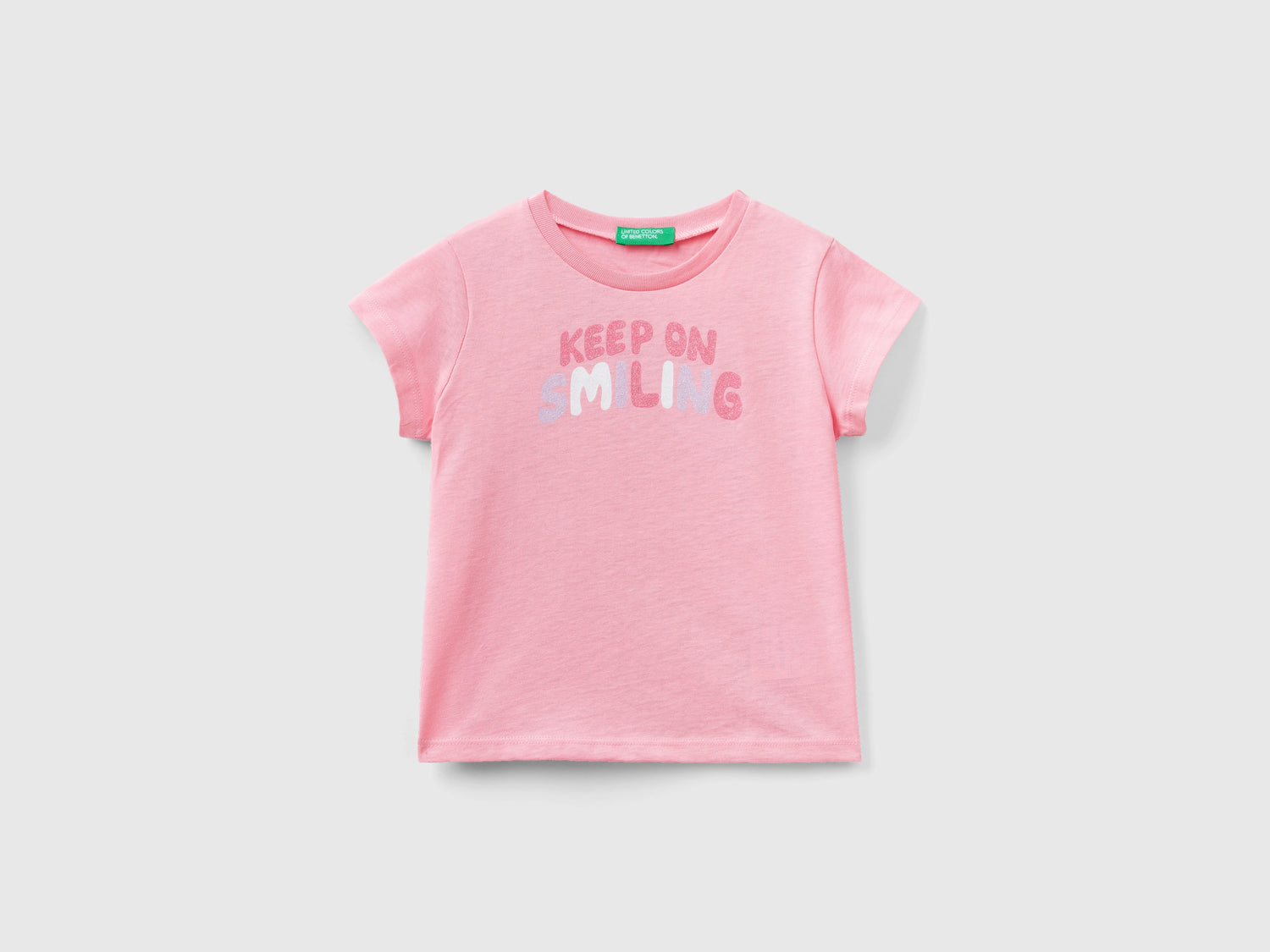 T-shirt in cotone bio con glitter da bimba rosa | Benetton Outlet