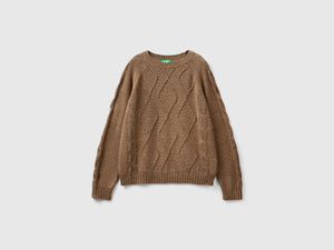 Maglione con trecce e losanghe