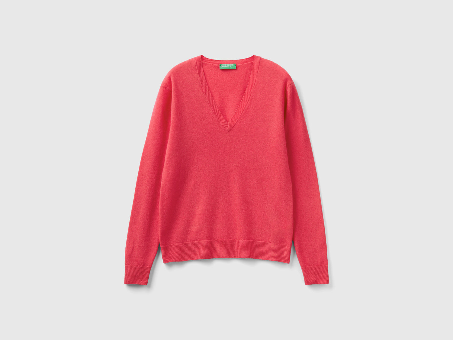 Maglia con scollo a V in pura lana Merino da donna fucsia | Benetton Outlet
