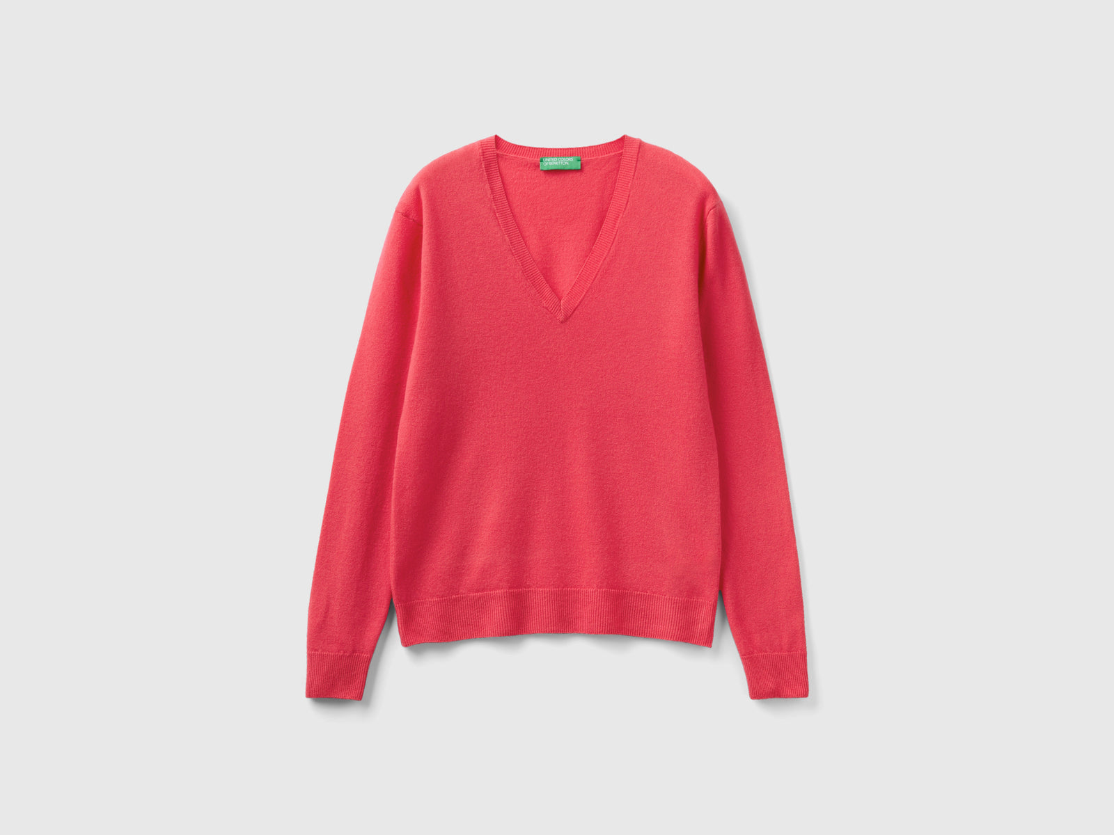 Maglia con scollo a V in pura lana Merino da donna fucsia | Benetton Outlet