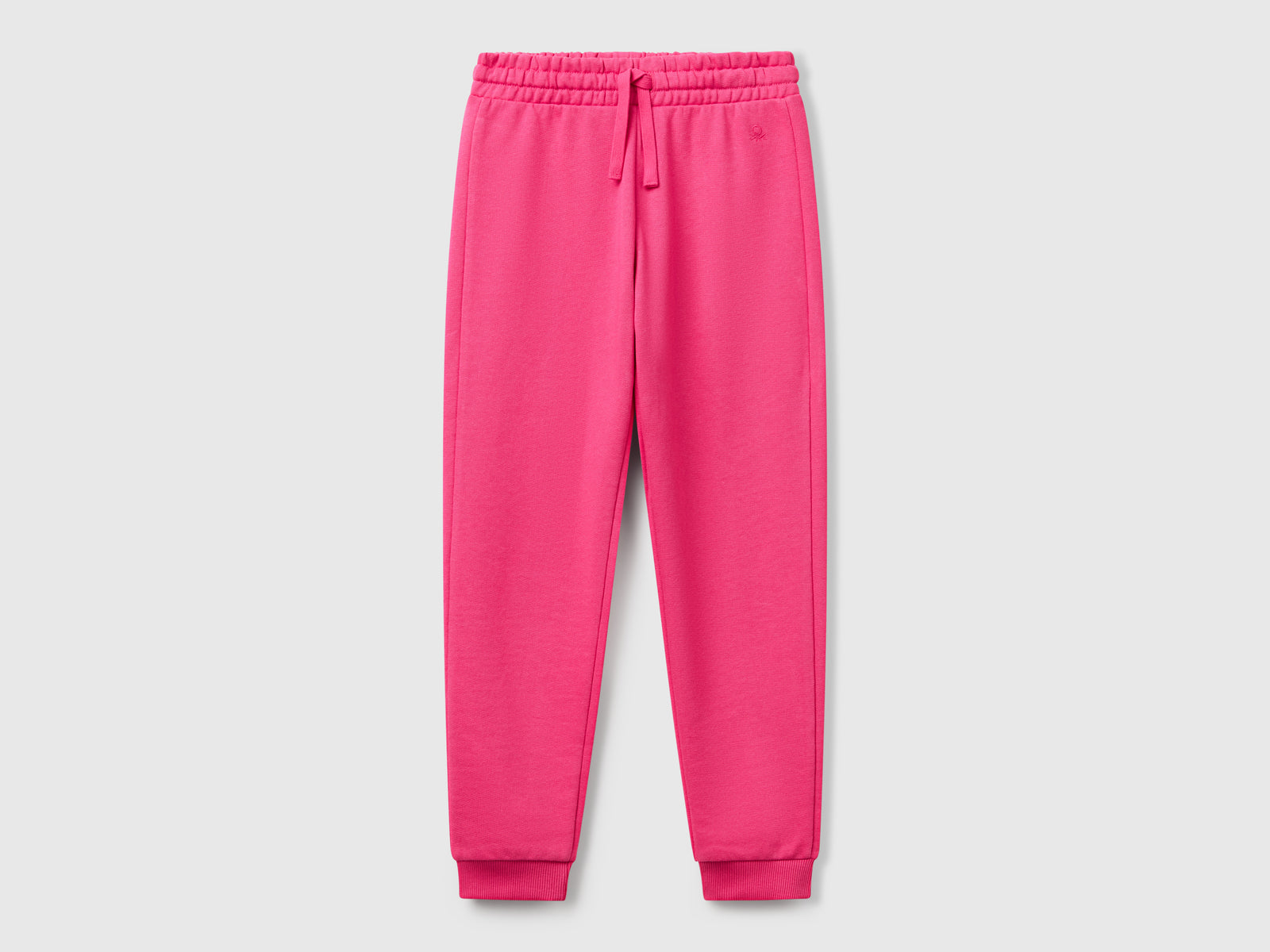 Pantaloni in felpa con logo da bambina fucsia | Benetton Outlet