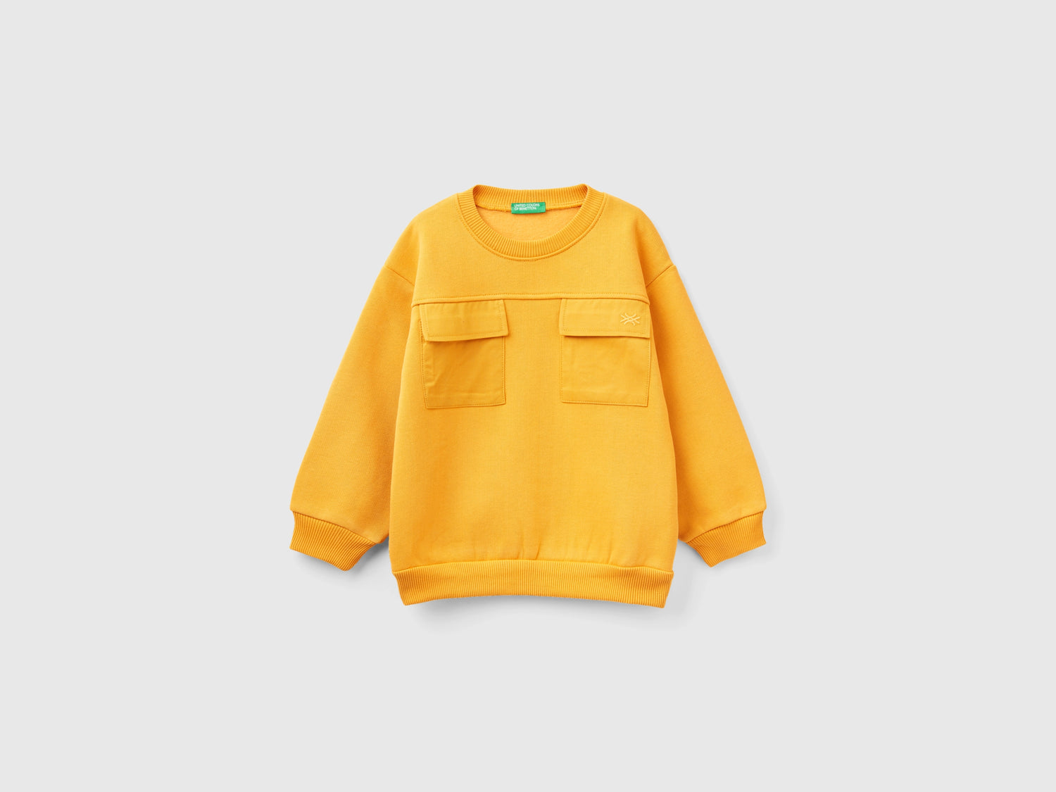 Calda felpa con tasche da bimbo giallo | Benetton Outlet