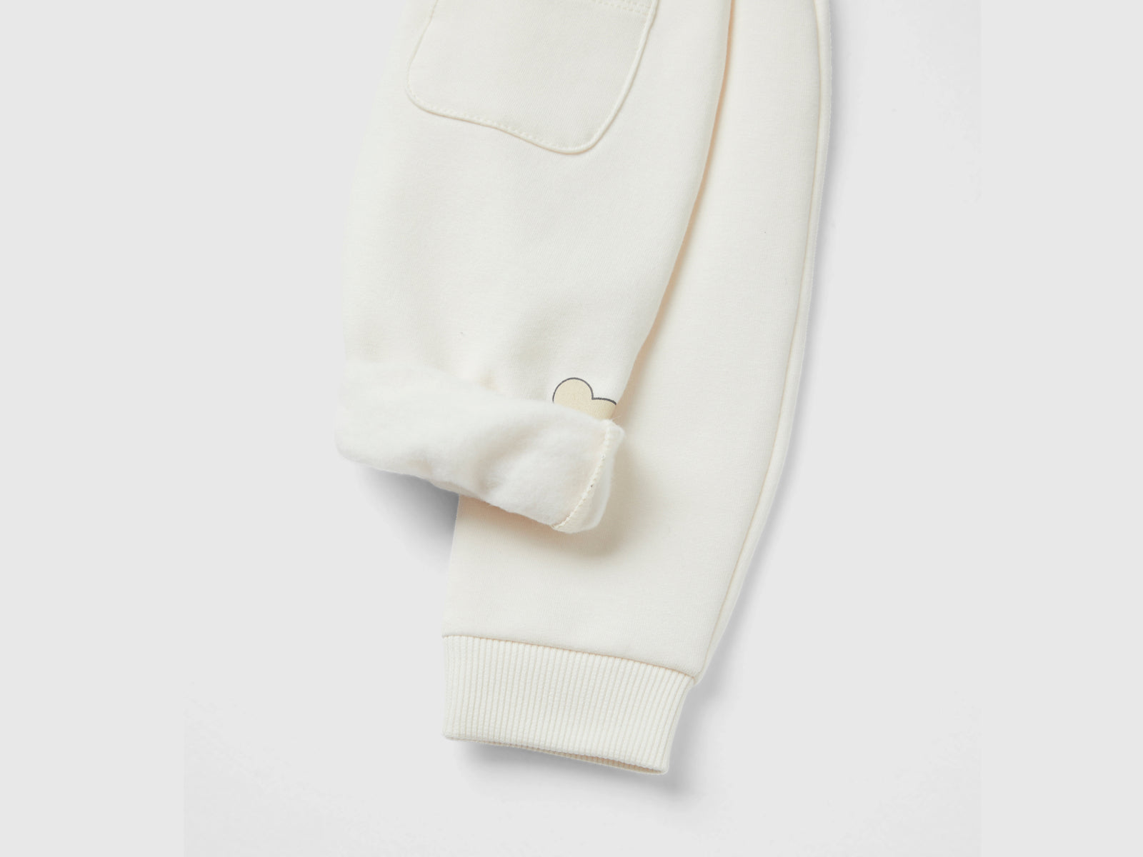 Pantaloni in calda felpa con taschino da neonato bianco panna 3 | Benetton Outlet