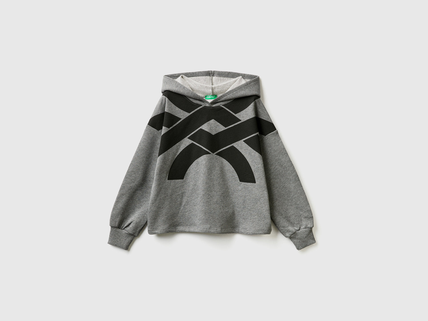 Felpa over fit con cappuccio da bambina grigio scuro | Benetton Outlet