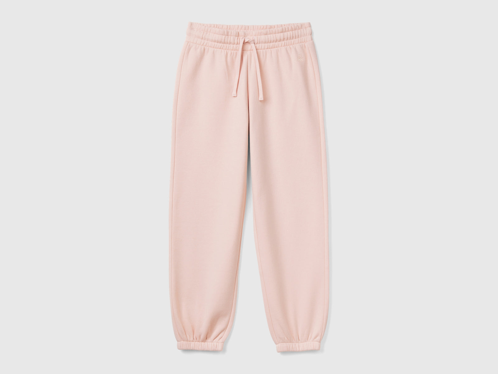 Joggers in felpa con coulisse da bambina rosa tenue | Benetton Outlet