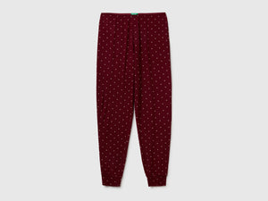 Pantaloni rossi con stampa pois
