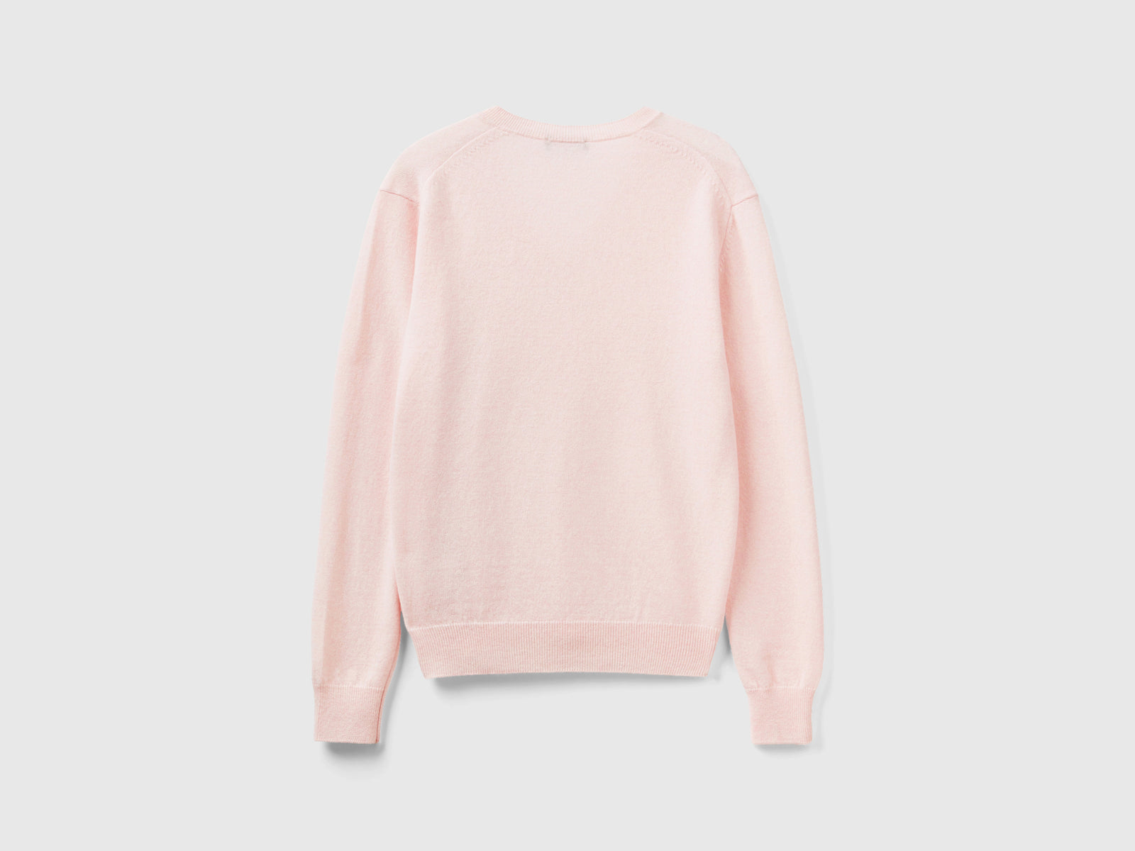 Maglia con scollo a V in pura lana Merino da donna rosa pastello 2 | Benetton Outlet