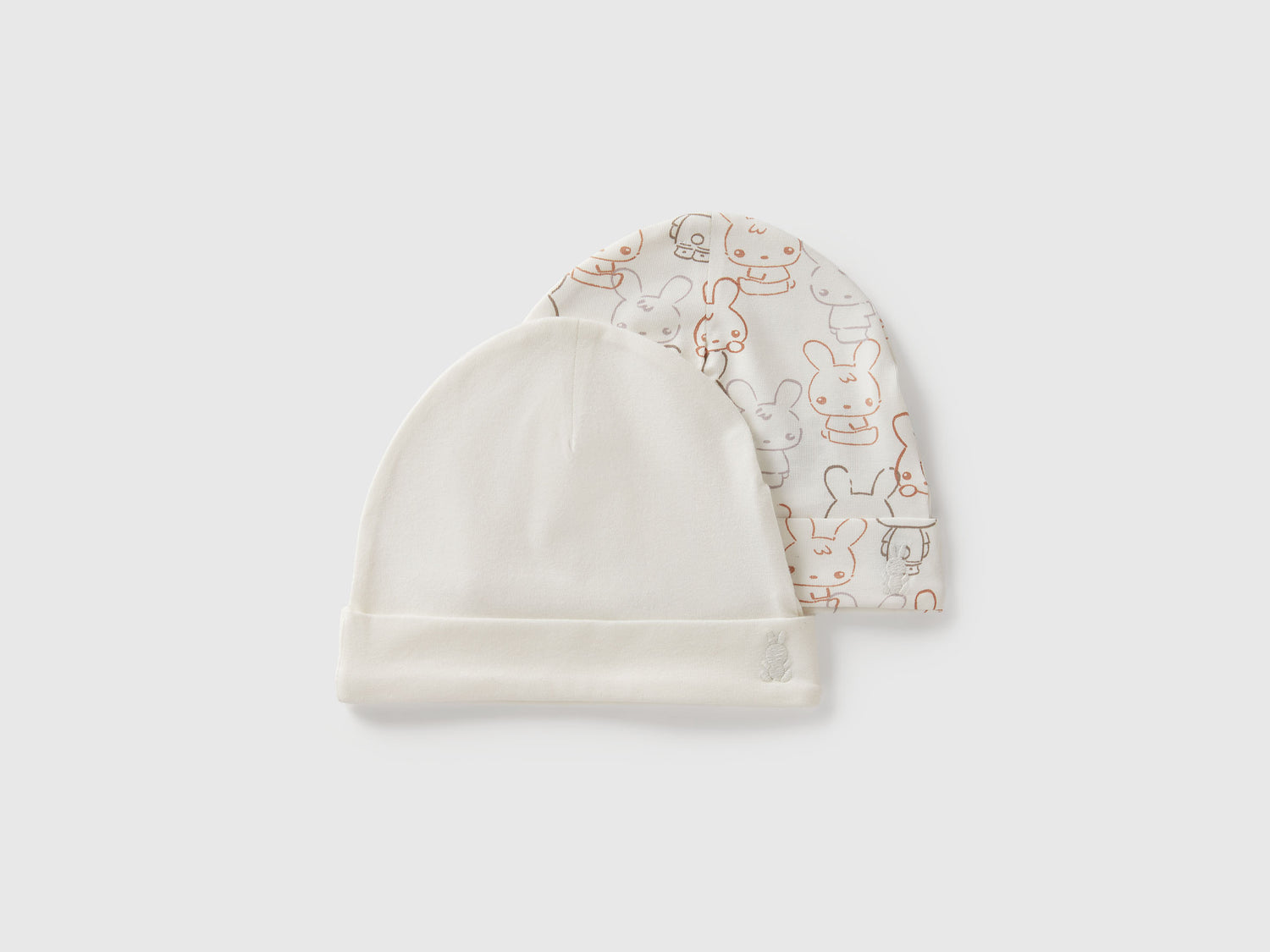 Due cappelli in cotone da neonato bianco panna | Benetton Outlet
