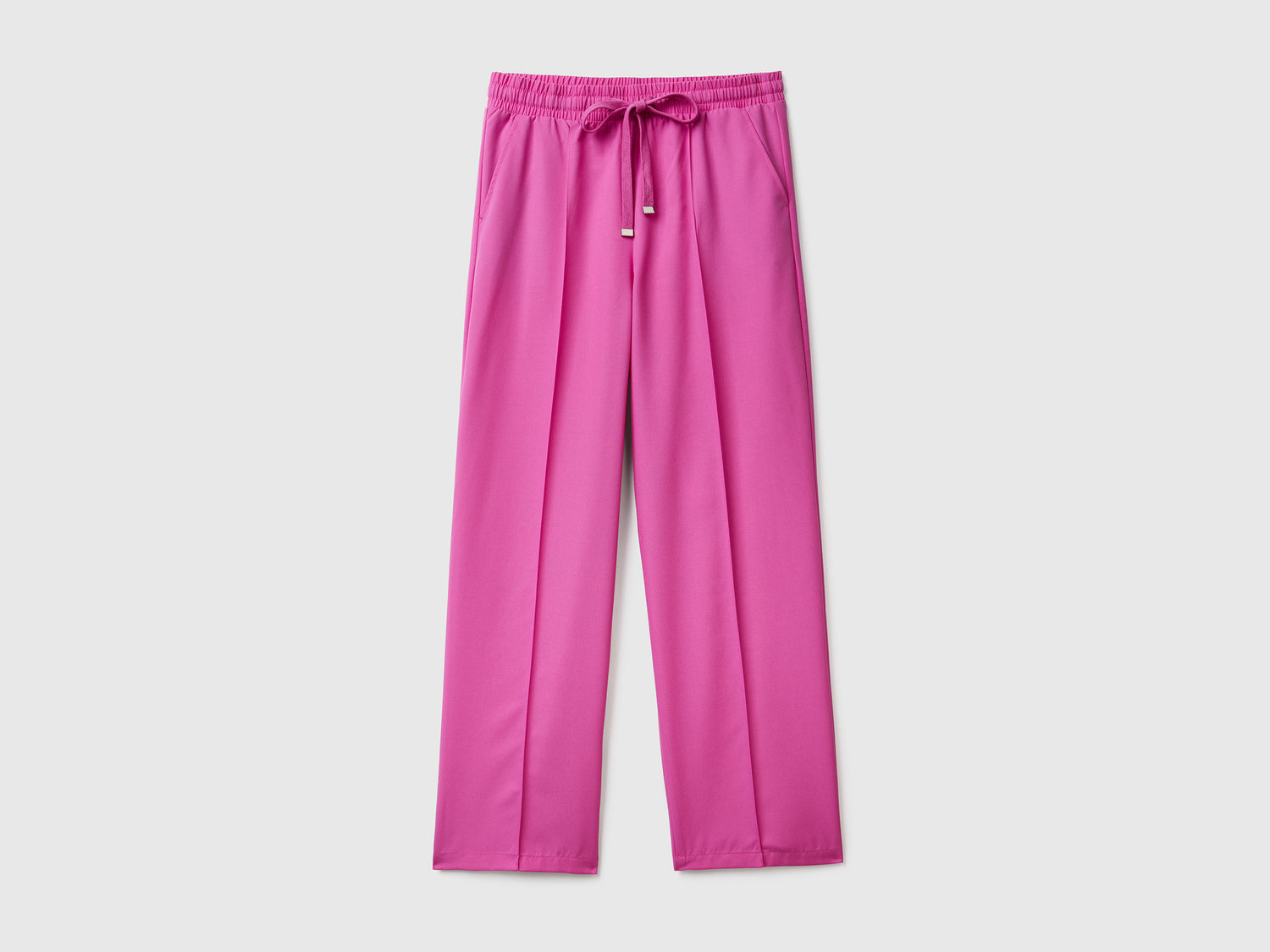 Pantaloni lunghi fluidi modello jogger in misto viscosa da donna rosa | Benetton Outlet