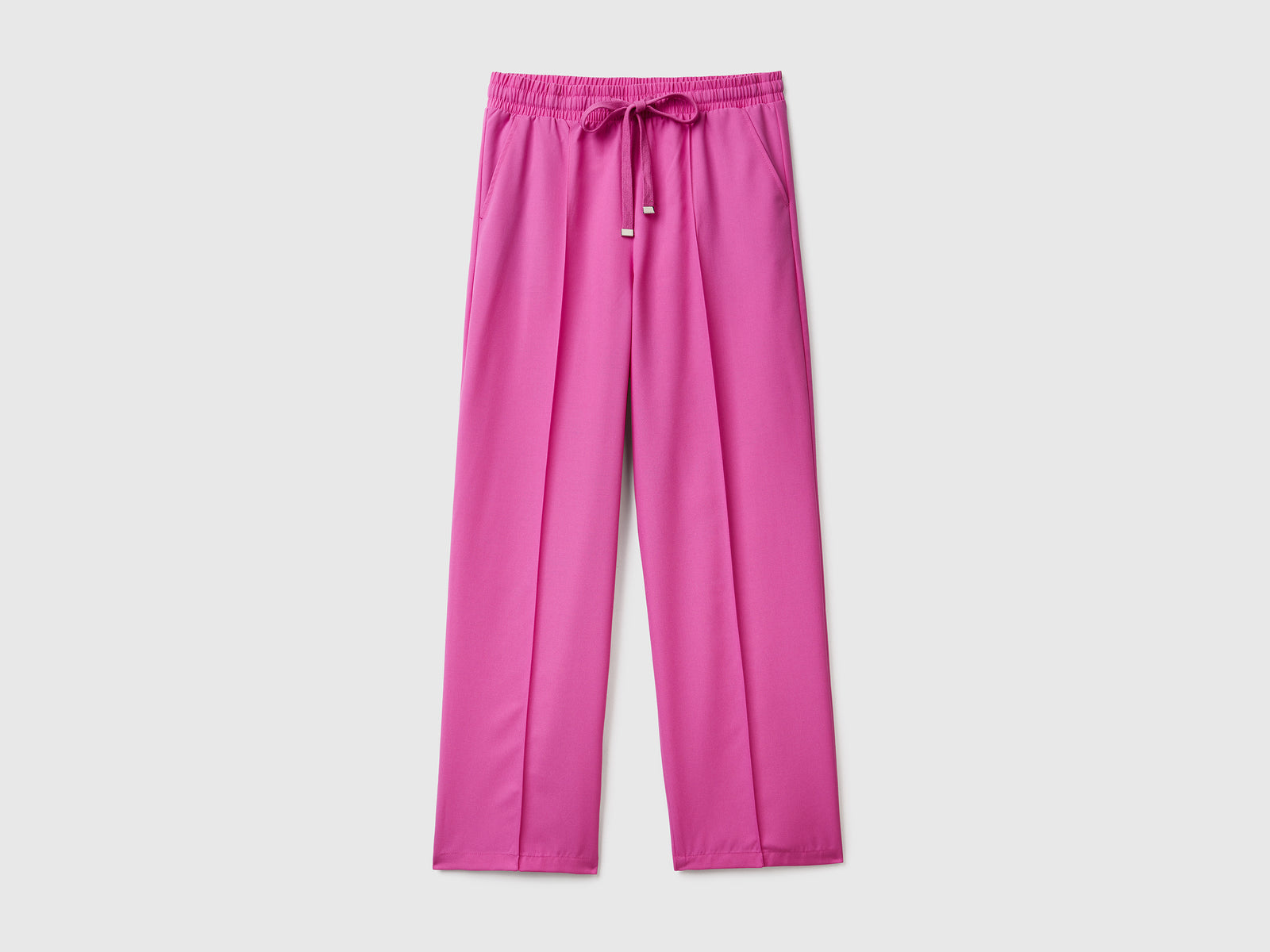 Pantaloni lunghi fluidi modello jogger in misto viscosa da donna rosa | Benetton Outlet