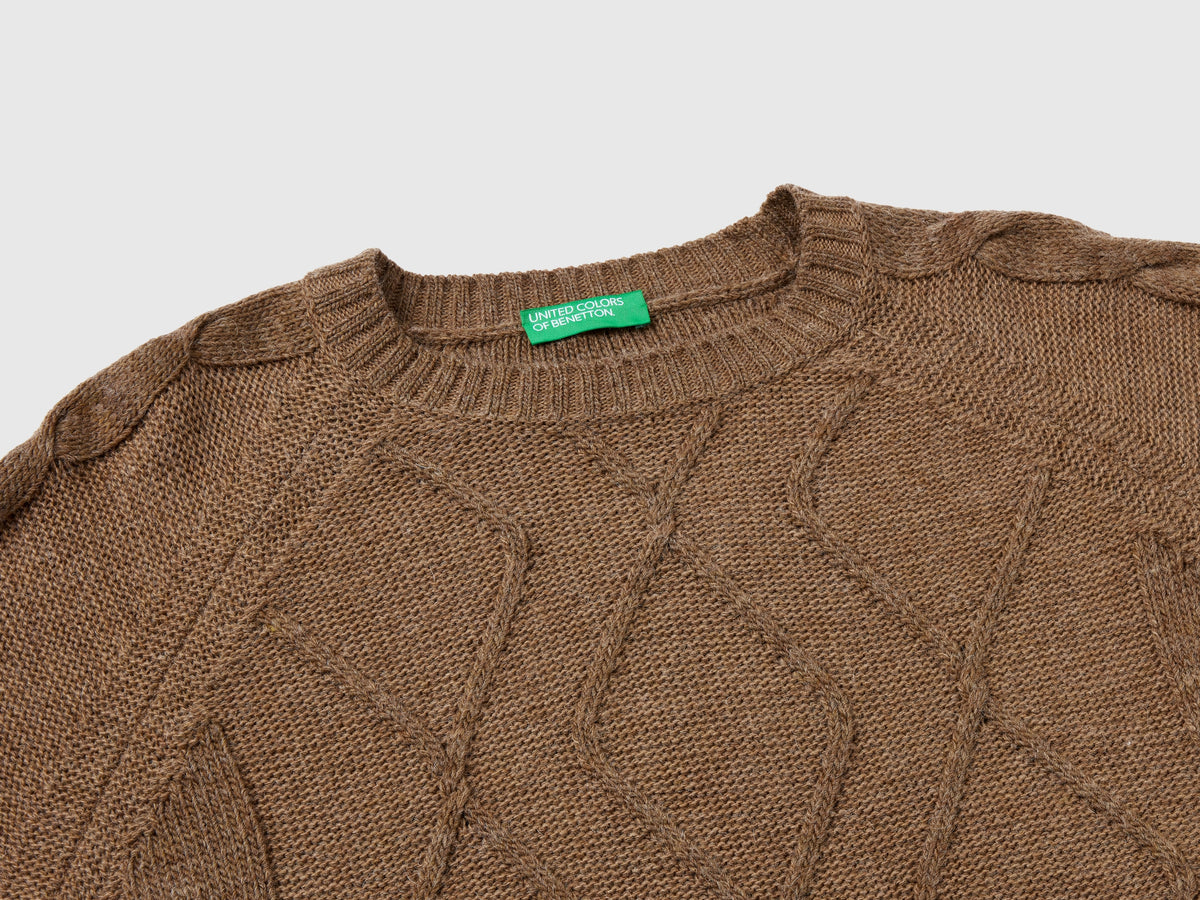 Maglione con trecce e losanghe