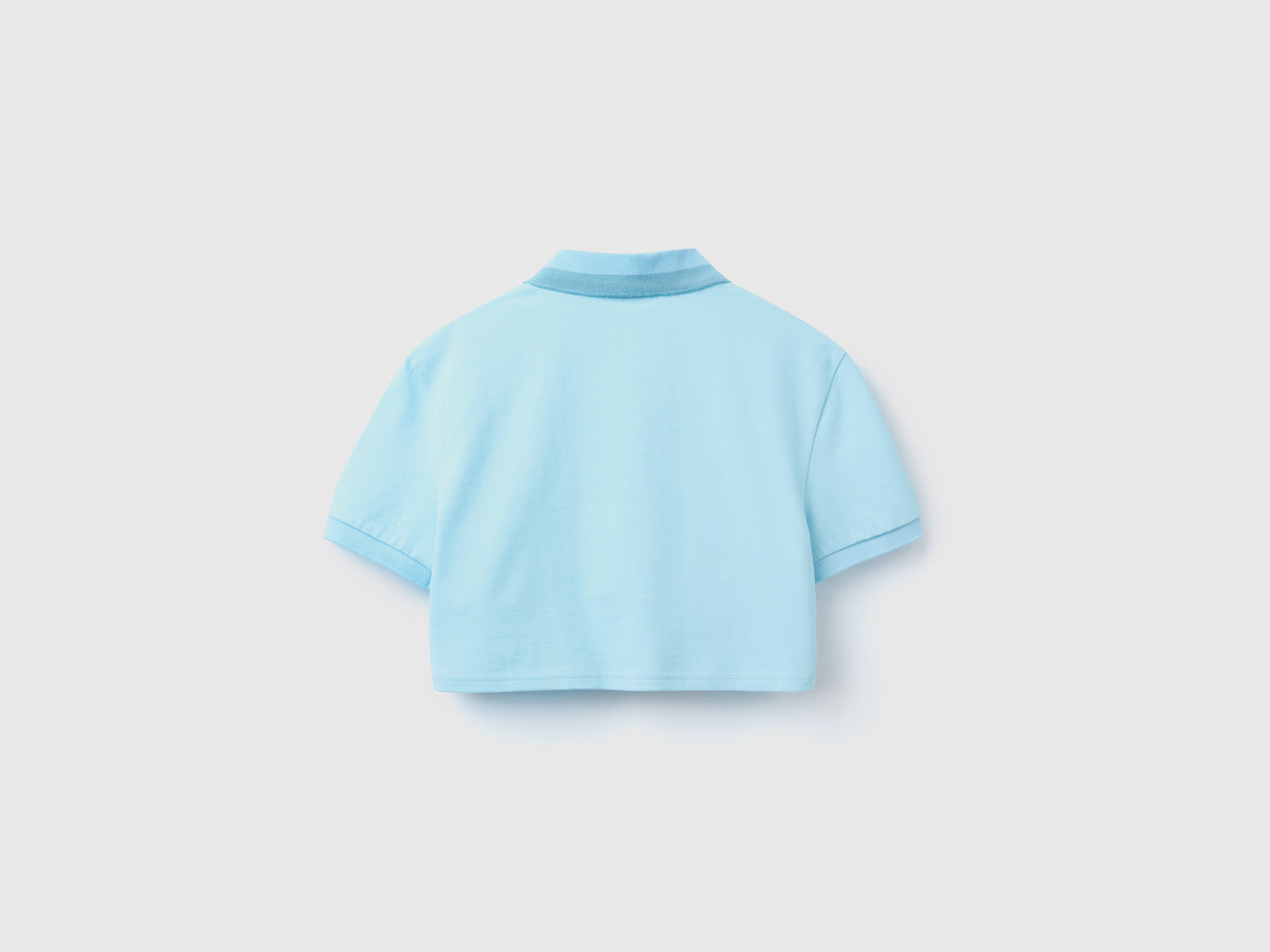Polo cropped con ricamo frutta