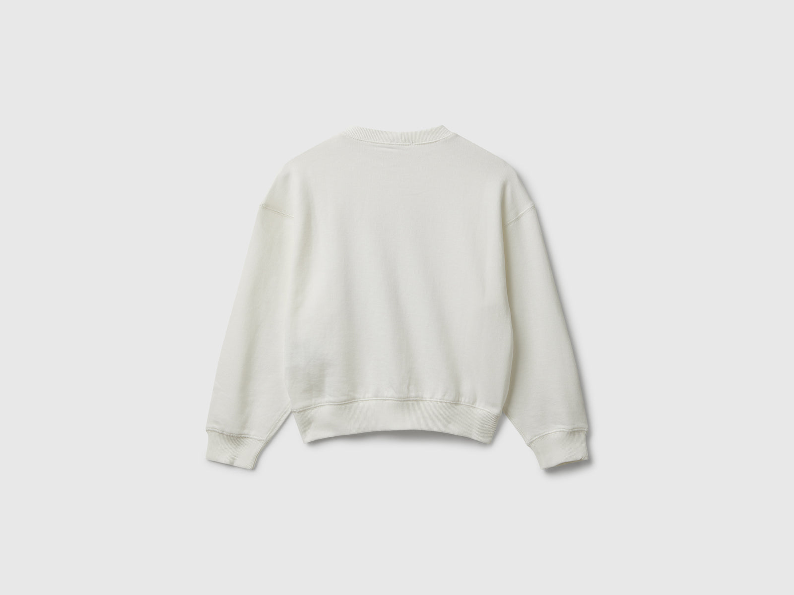 Felpa con paillettes da bambina bianco panna 2 | Benetton Outlet