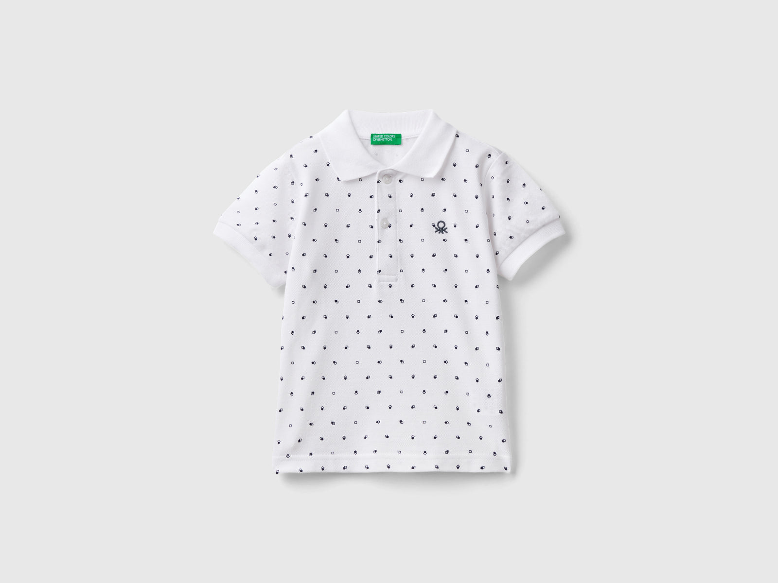 Polo micro fantasia slim fit da bimbo bianco | Benetton Outlet