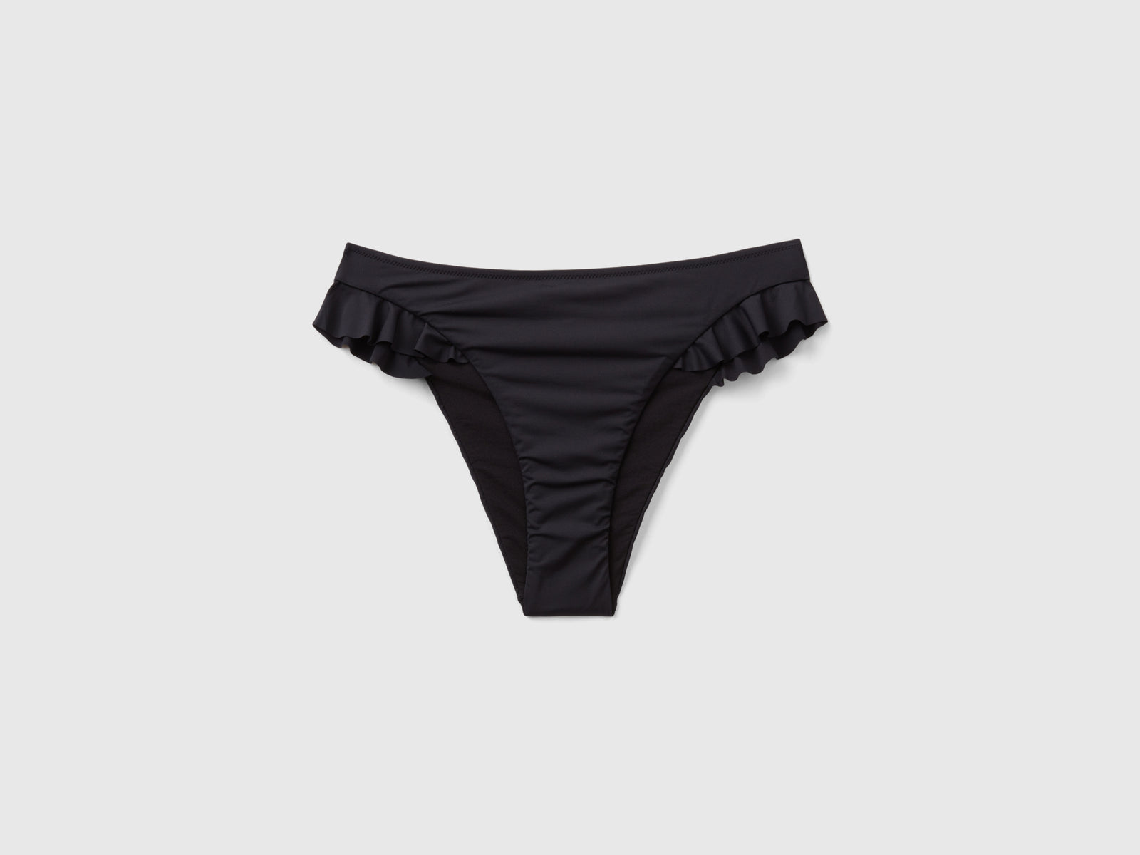 Slip costume con balze in ECONYL® da donna nero | Benetton Outlet