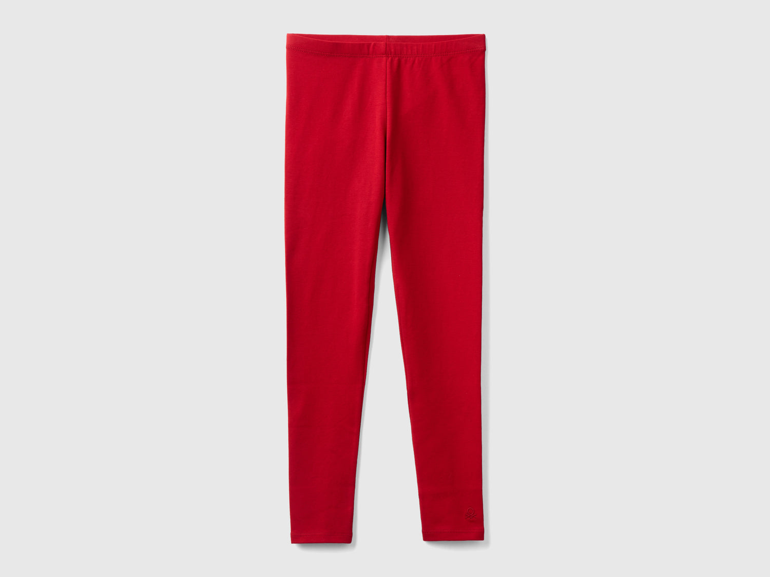 Leggings in cotone stretch con logo da bambina rosso | Benetton Outlet